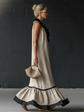 Abito lungo elegante con volant